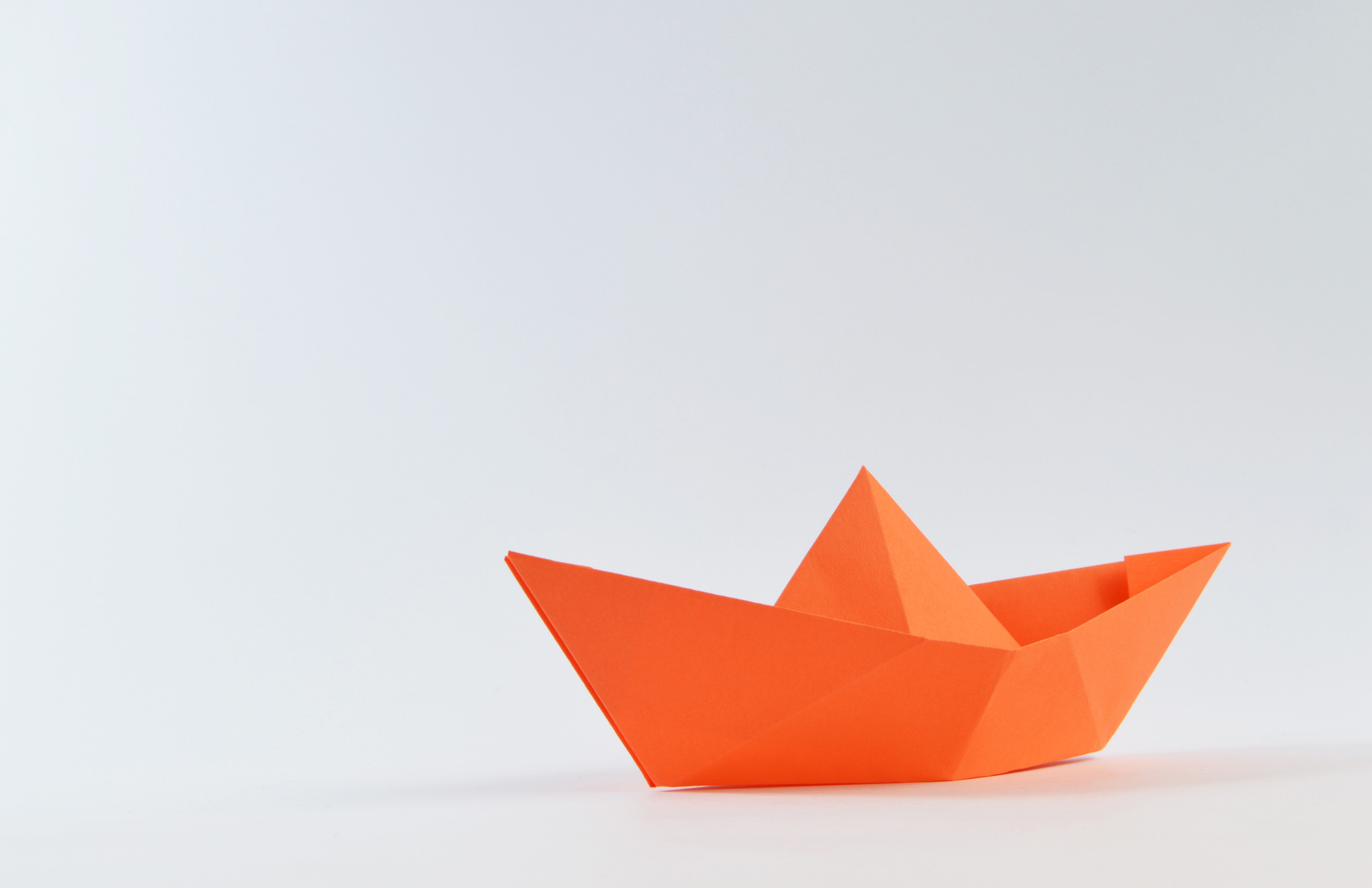 orange paper sailboat with shadow | unique print ideas | mmprint.com